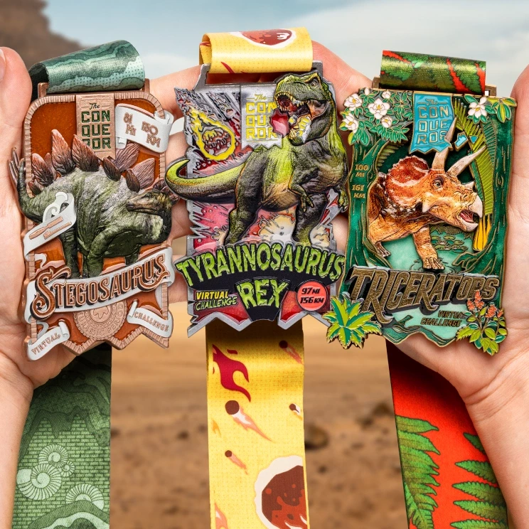 Dinosaur Series medal held in hand