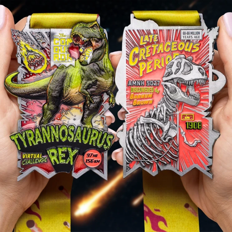 Tyrannosaurus Rex medal held in hand