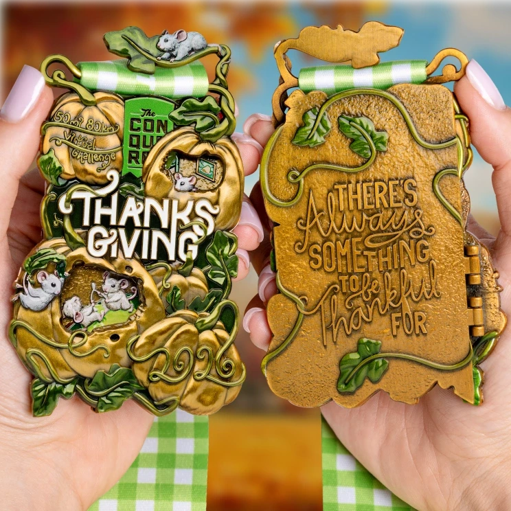 Thanksgiving 2026 medal held in hand